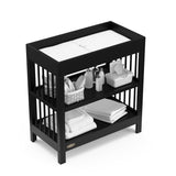 Graco® Teddi® Changing Table with Bonus Water-Resistant Changing Pad.