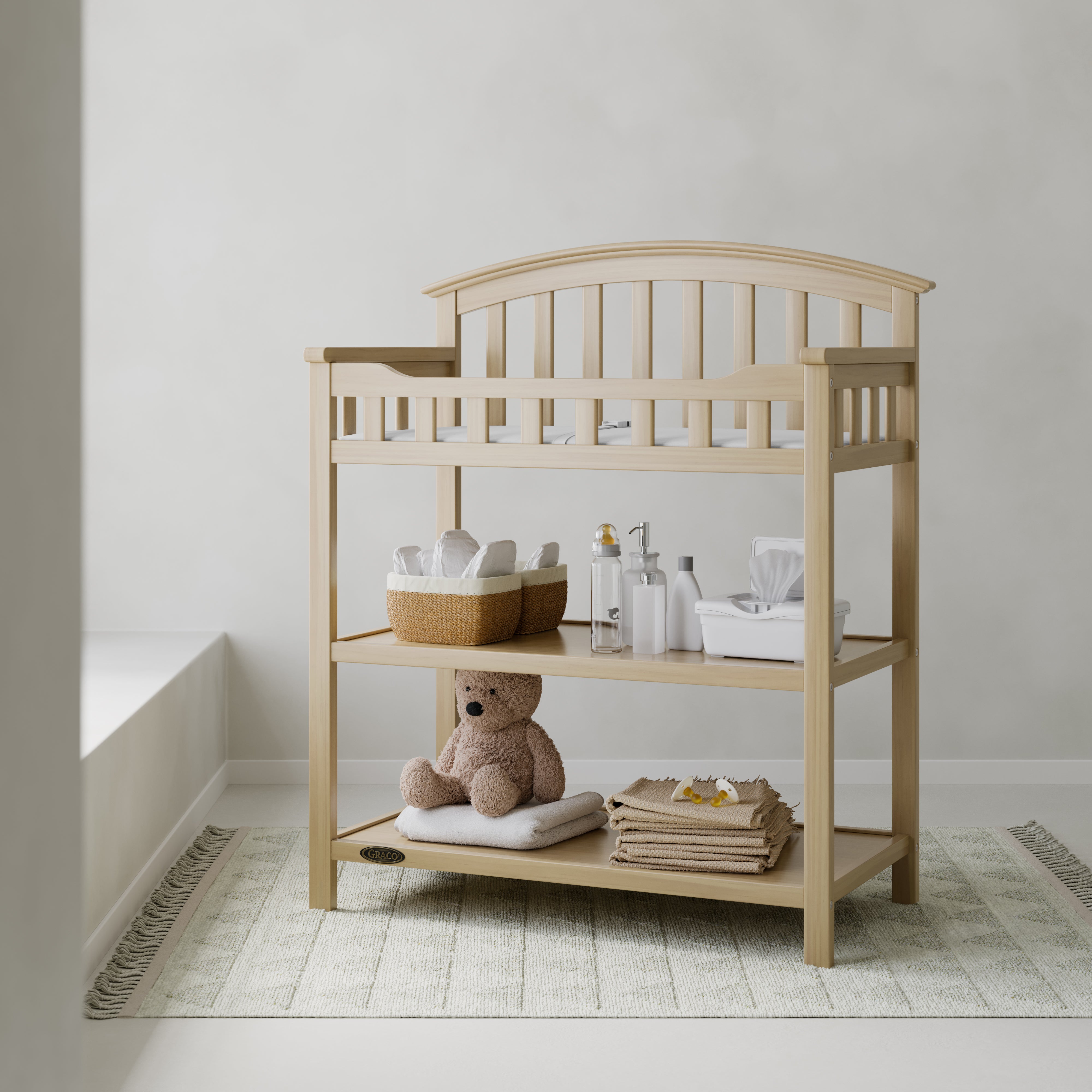 Graco driftwood changing table in nursery