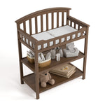Graco hazelnut changing table top view with baby items on bottom shelves