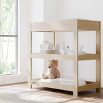 Graco driftwood customizable changing table in nursery
