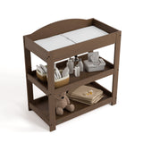 Graco hazelnut customizable changing table top view with baby items on bottom shelves
