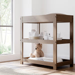 Graco hazelnut customizable changing table in nursery