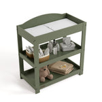 Graco olive customizable changing table top view with baby items on bottom shelves