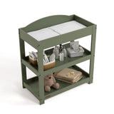 Graco olive customizable changing table top view with baby items on bottom shelves