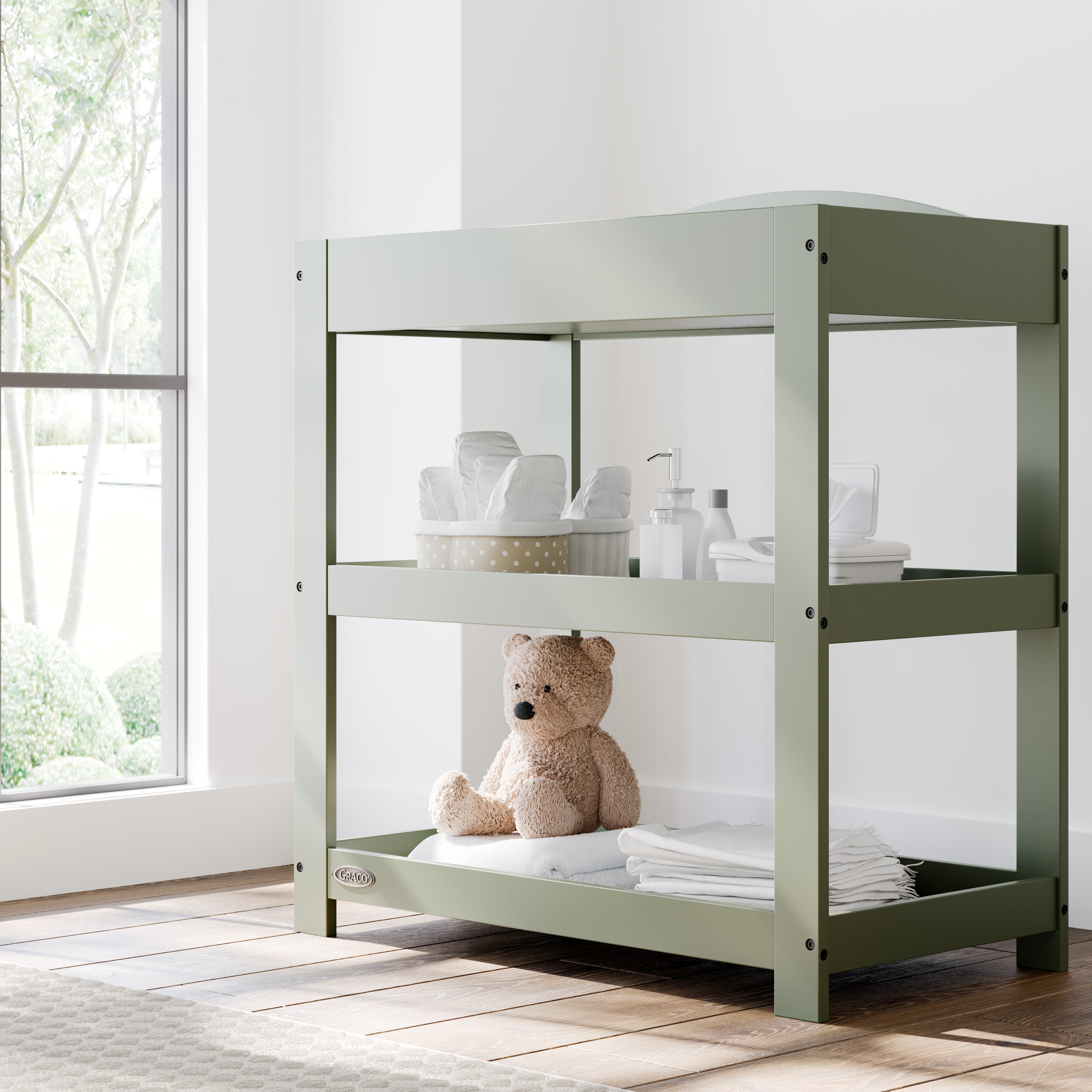Graco olive customizable changing table in nursery