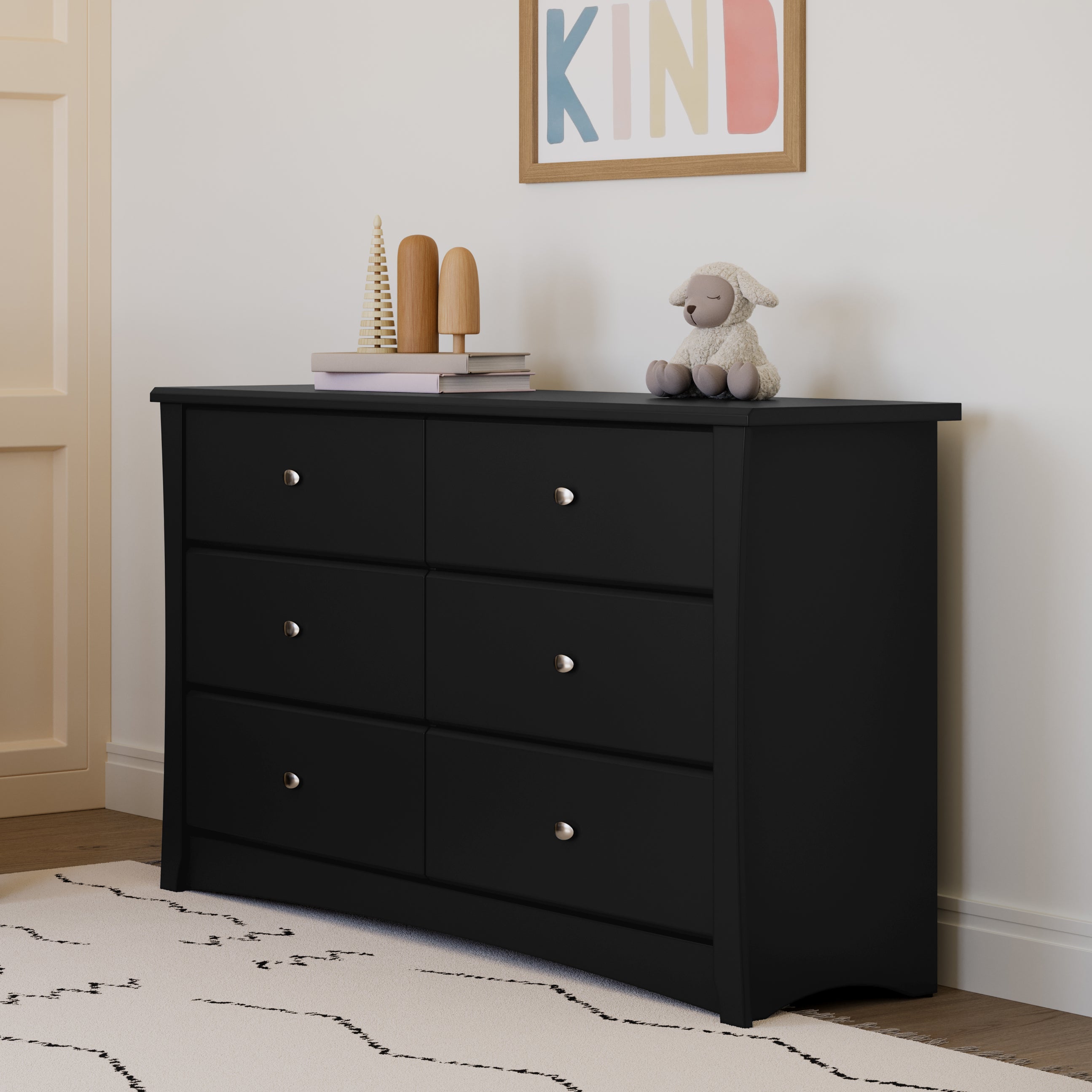 Black 6 drawer dresser in nursery