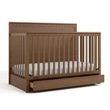 Sasha hazelnut crib with drawer angle view