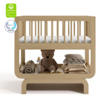 Santorini driftwood bassinet with GGG and PTPA logos on top left