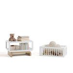 Santorini white with driftwood bassinet converted to toybox and bookshelf with baby items inside