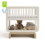 Santorini frosted oat with driftwood bassinet with GGG and PTPA logos on top left