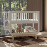 Santorini frosted oat with driftwood bassinet in nursery