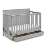 Hadley pebble gray crib with drawer open angle view