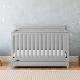 Hadley pebble gray crib with drawer in nursery