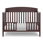 Benton espresso crib converted to toddler bed with two guardrails
