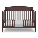 Benton espresso crib converted to toddler bed with two guardrails
