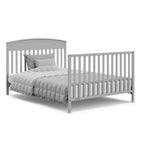 Benton pebble gray crib converted to full-size bed with footboard