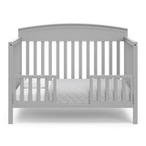 Benton pebble gray crib converted to toddler bed with two guardrails