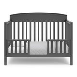 Benton gray crib converted to toddler bed with two guardrails