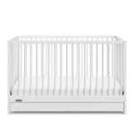 White crib with drawer angled