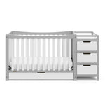 Front view of Pebble gray and white crib with drawer and changer