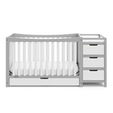 Front view of Pebble gray and white crib with drawer and changer