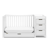 White crib and changer with drawer in toddler bed conversion