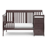 espresso crib in toddler bed conversion with one safety guardrail
