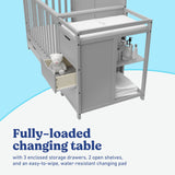 Hadley pebble gray crib and changer side view of changing table