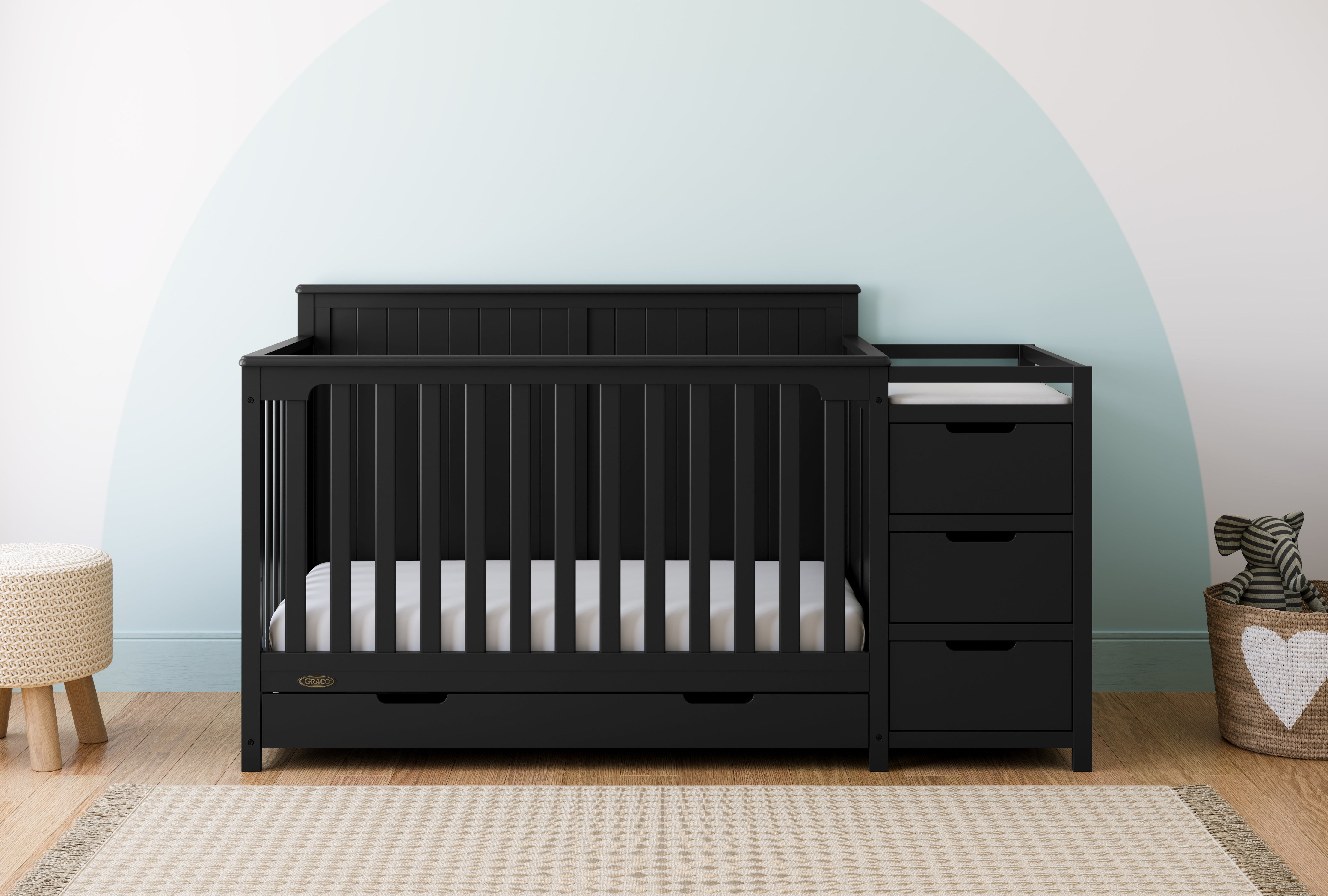 black crib and changer with drawer in nursery
