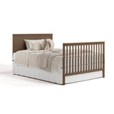 Sasha hazelnut crib with drawer converted to full-size bed with footboard
