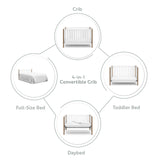 White crib with driftwood with conversion graphic