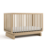 Storkcraft® Santorini® Deluxe 5-in-1 Convertible Crib with Bonus Toddler Guardrail.