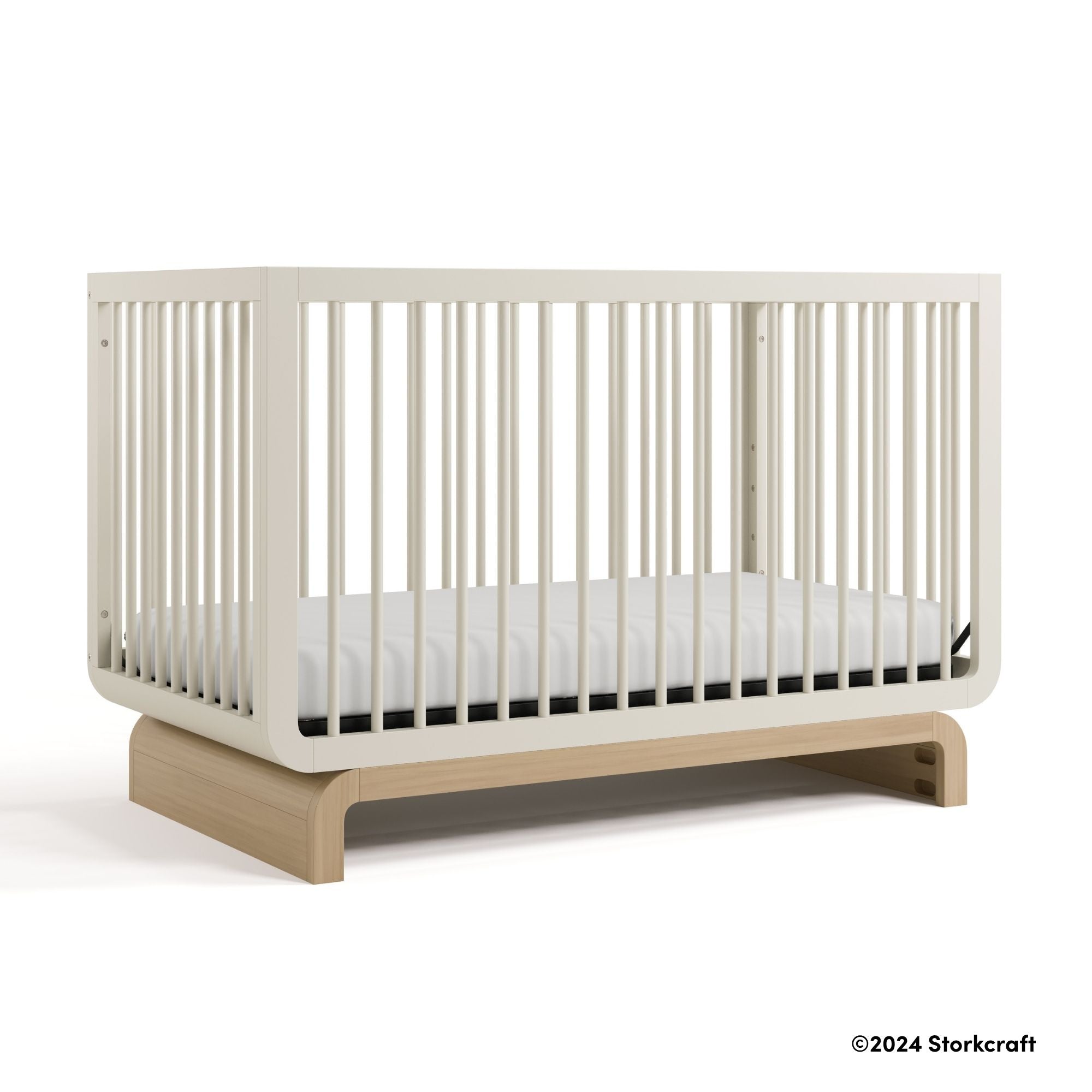 Santorini frosted oat with driftwood crib with 2024 Storkcraft copyright on bottom right