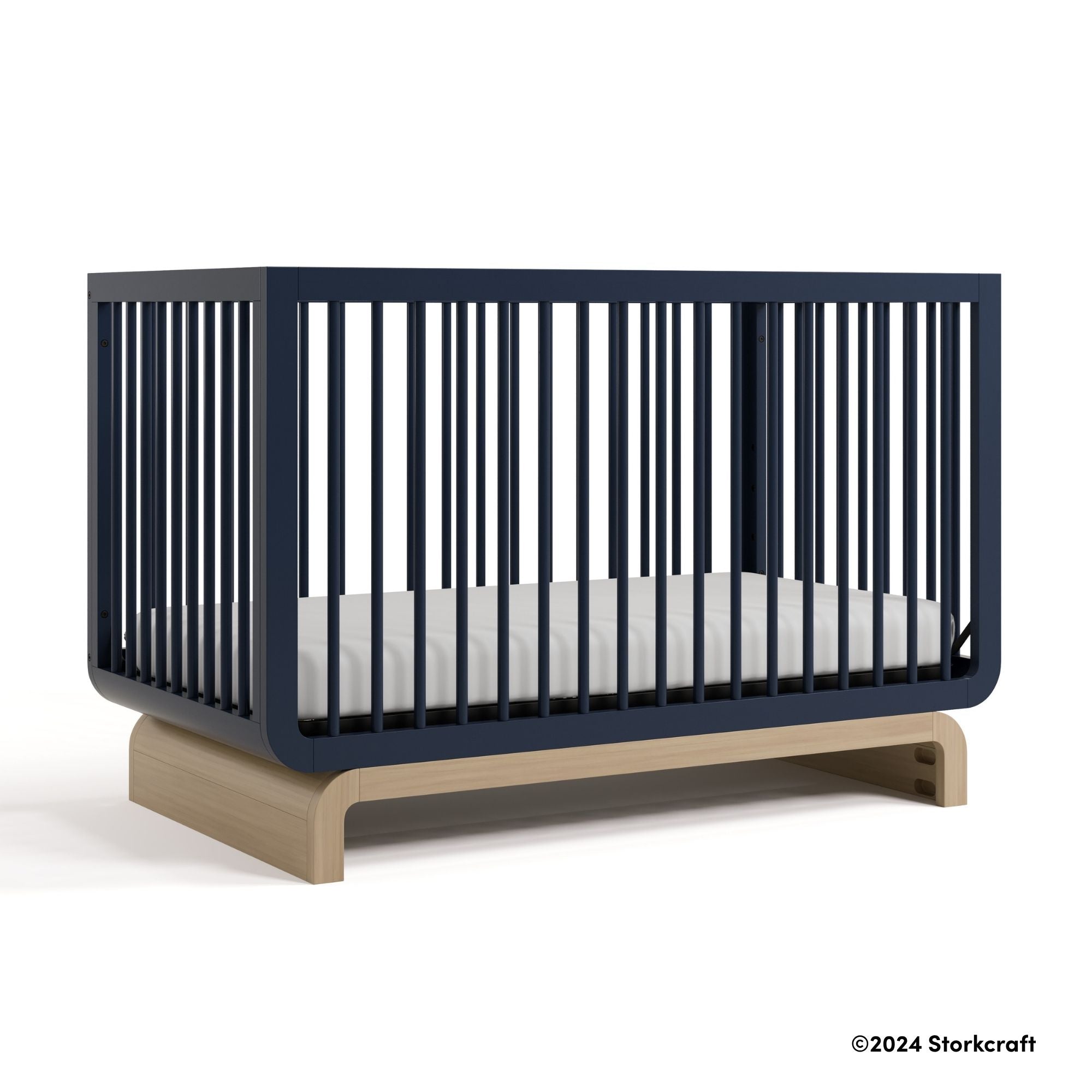 Santorini midnight blue with driftwood crib with 2024 Storkcraft copyright on bottom right