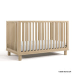 Sicily driftwood crib with 2025 Storkcraft copyright on bottom right