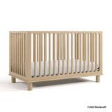 Sicily driftwood crib with 2025 Storkcraft copyright on bottom right