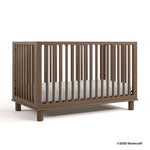 Sicily hazelnut crib with 2025 Storkcraft copyright on bottom right