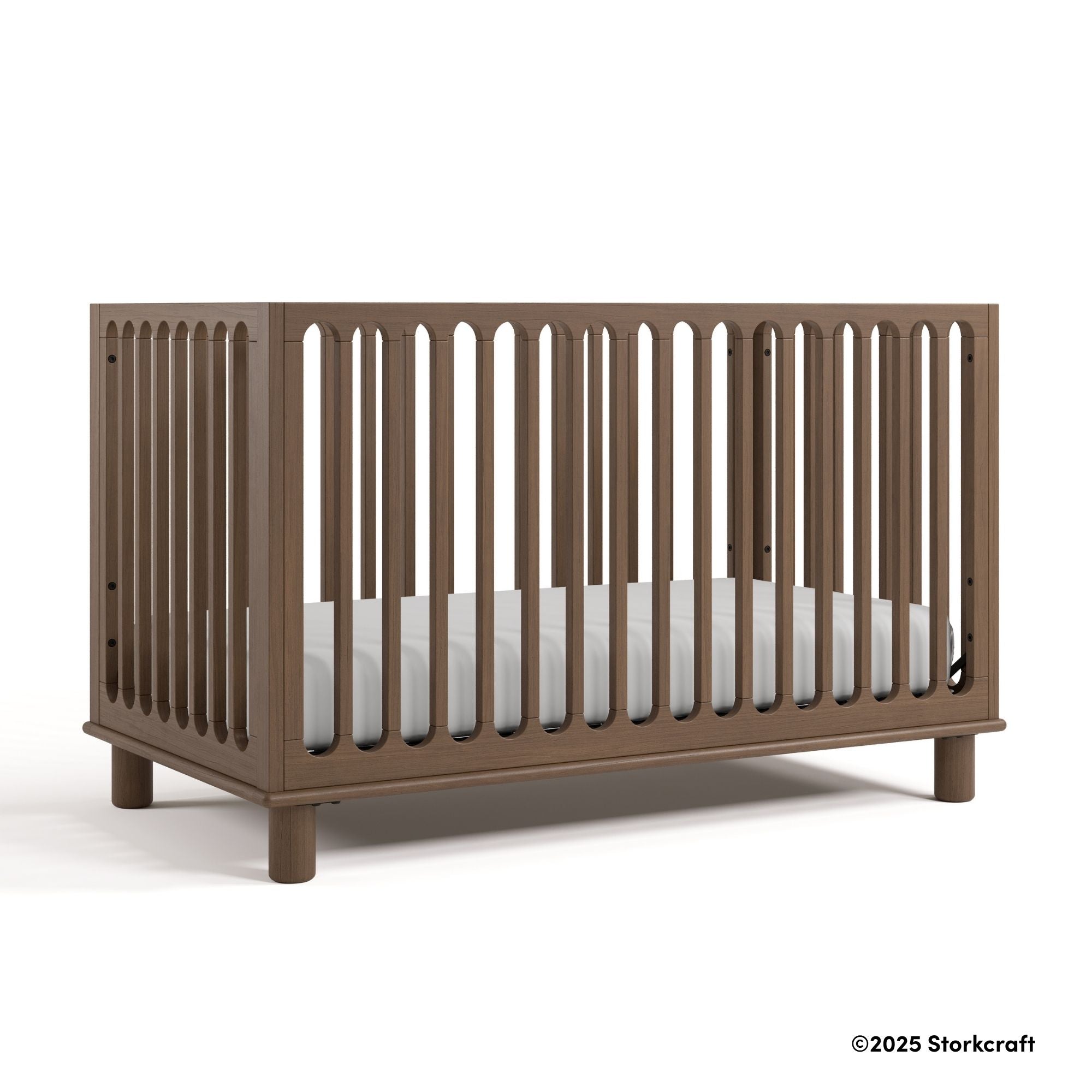 Sicily hazelnut crib with 2025 Storkcraft copyright on bottom right