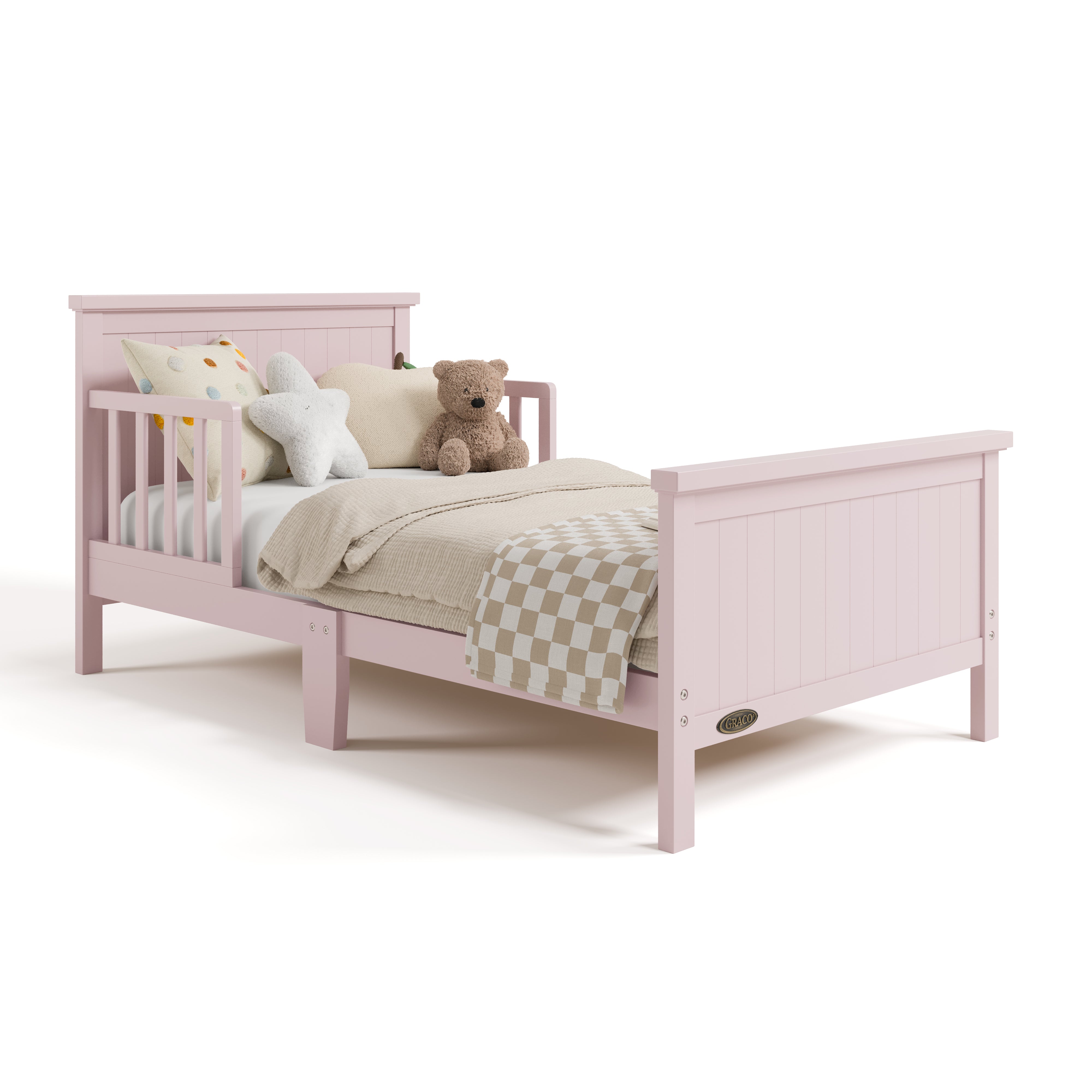 Bailey blush toddler bed with bedding angle view