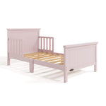 Bailey blush toddler bed without mattress angle view