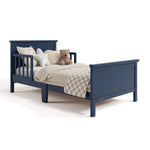 Bailey midnight blue toddler bed with bedding angle view