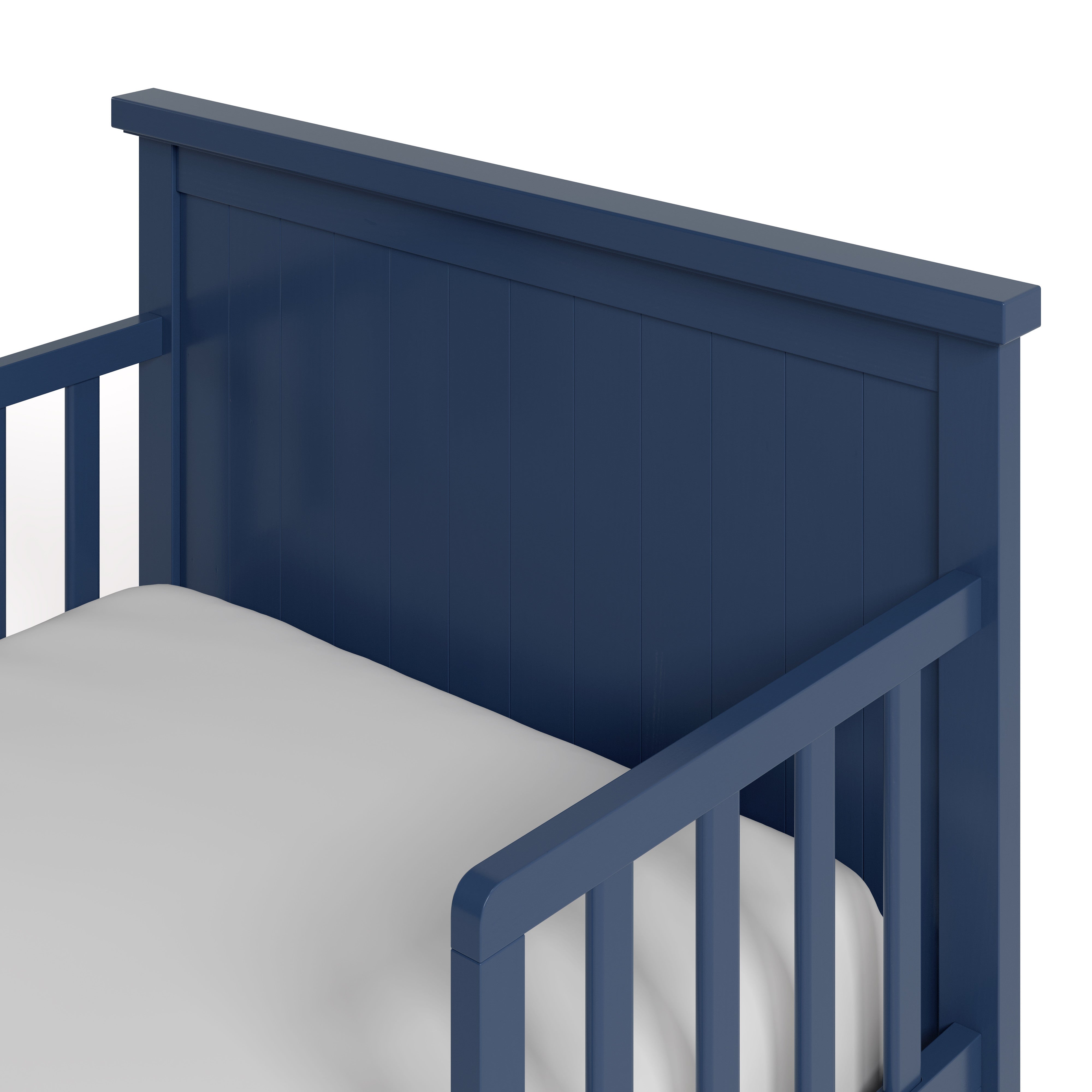 Bailey midnight blue toddler bed close up of headboard