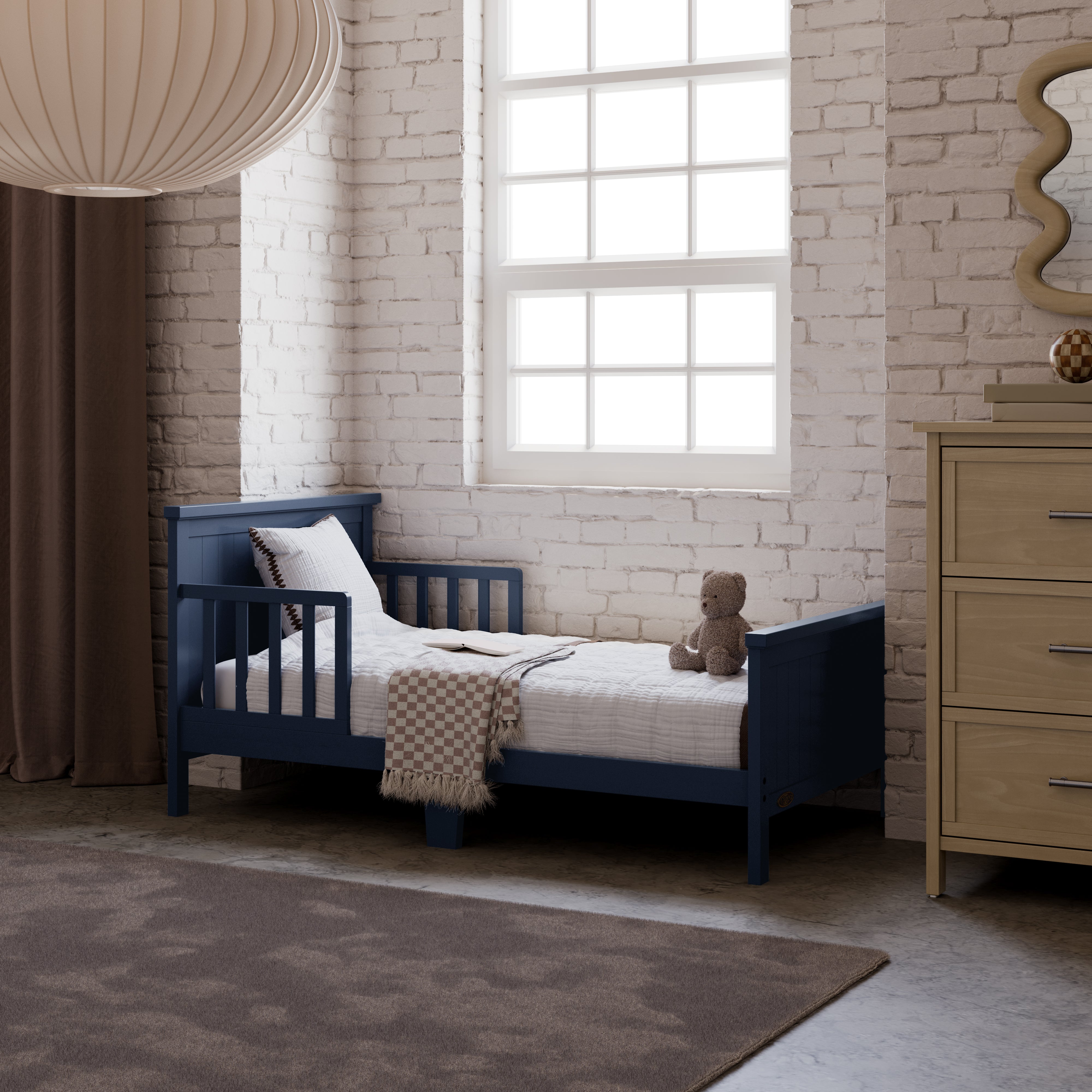 Bailey midnight blue toddler bed in kids room by window
