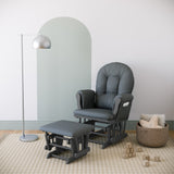 gray glider and ottoman with gray cushions in nursery