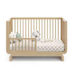 Storkcraft® Santorini® Deluxe 5-in-1 Convertible Crib with Bonus Toddler Guardrail.