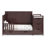 Hadley espresso crib and changer converted to toddler bed with one guardrail
