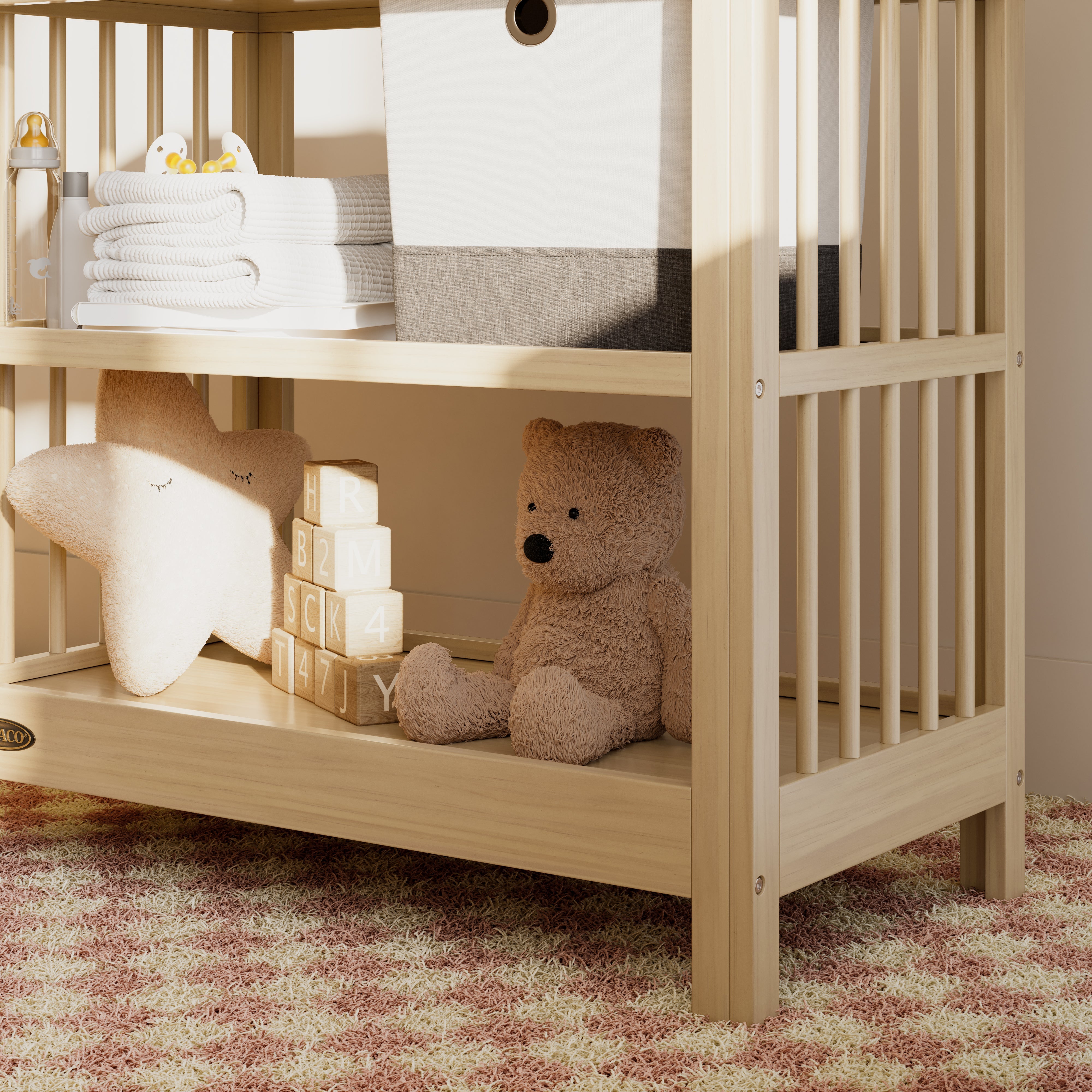 Close-up view of a driftwood changing table in the left corner.
