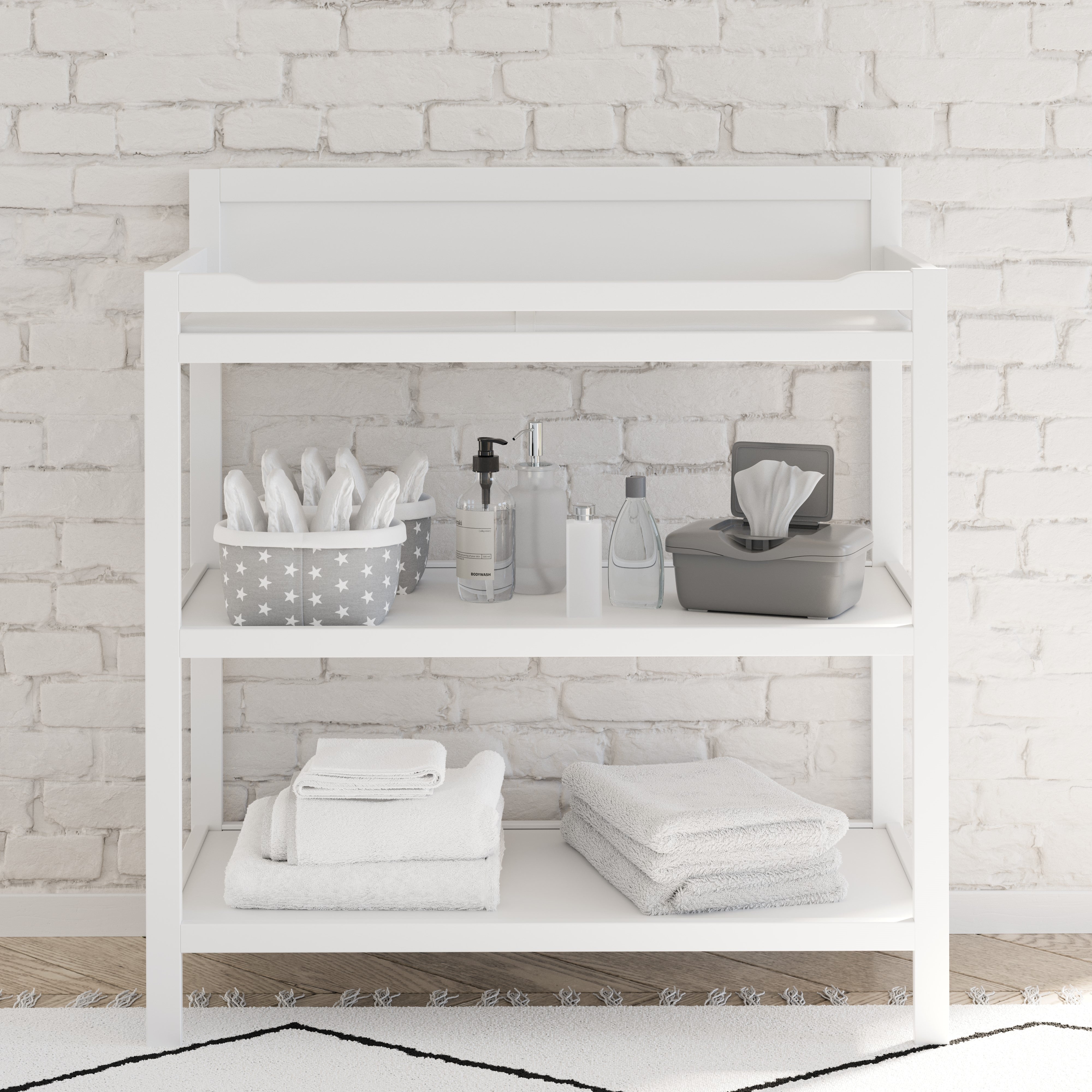 White changing table with storage in nursery