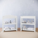 white changing table with removable headboard and two open shelves in nursery