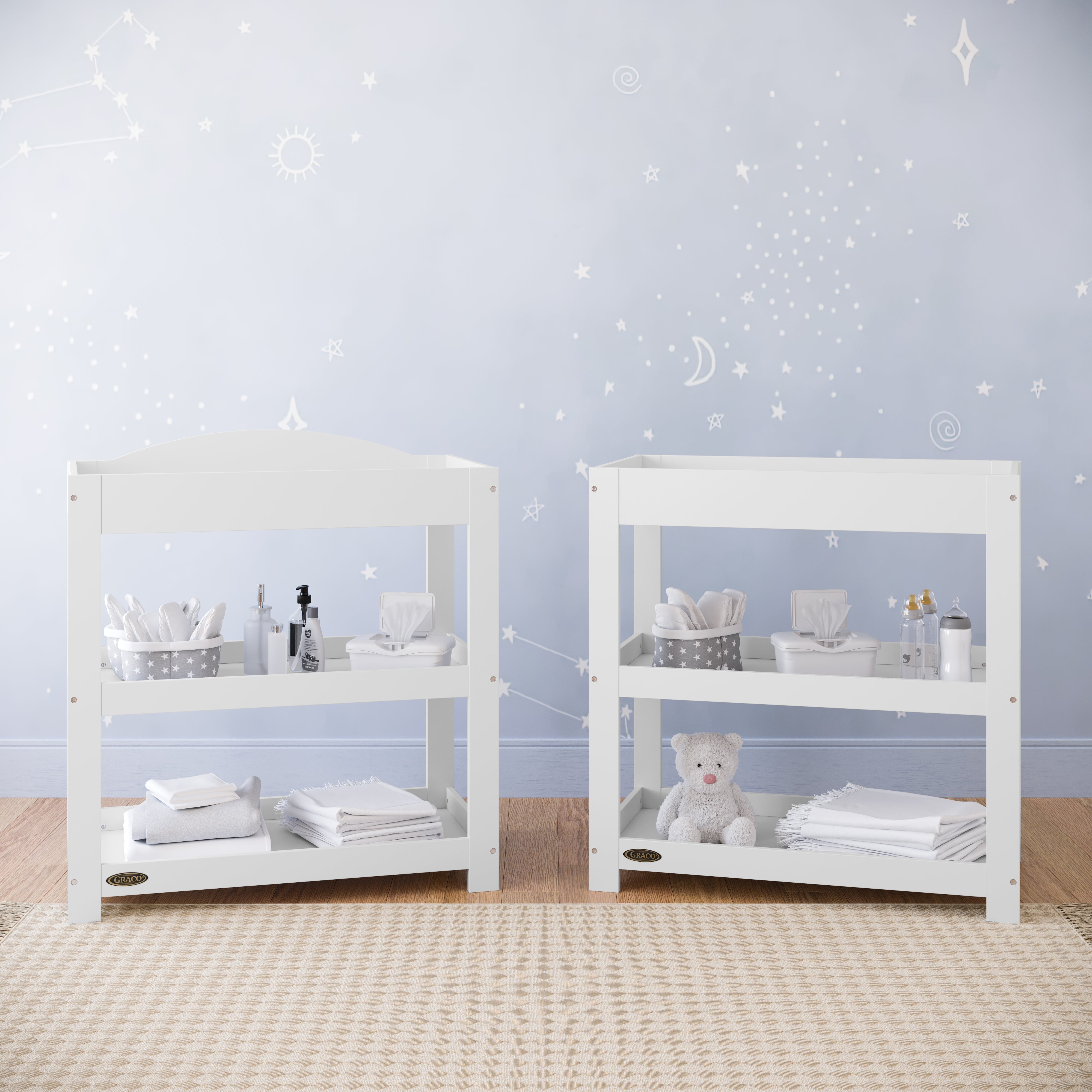 white changing table with removable headboard and two open shelves in nursery